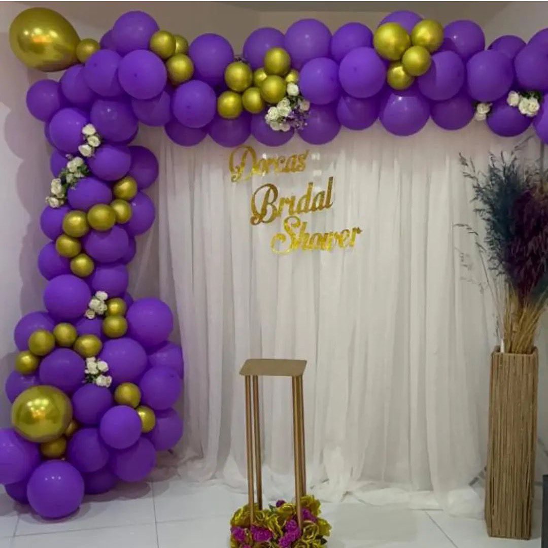 Dorcas Bridal Shower with purple and gold balloon arch by M&M Styles Abuja