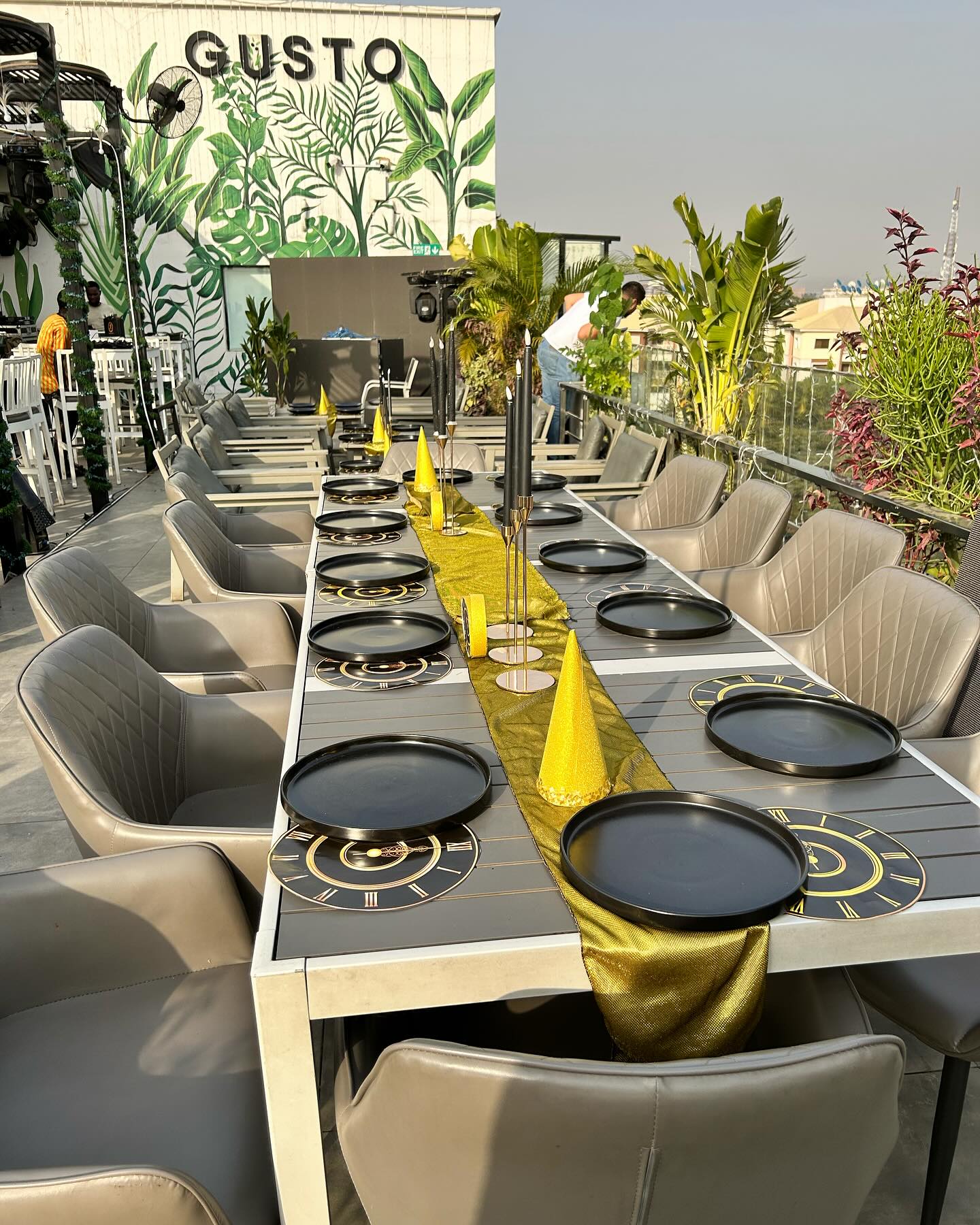 Glamour Gala rooftop luxury dining event with gold table runners styled by M&M Styles Abuja